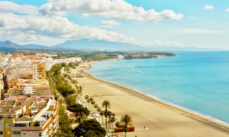 The Estepona seafront, the beach running along the edge of the town