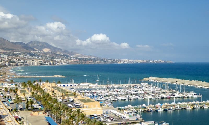 The marina at Fuengirola, boats and palms along the front