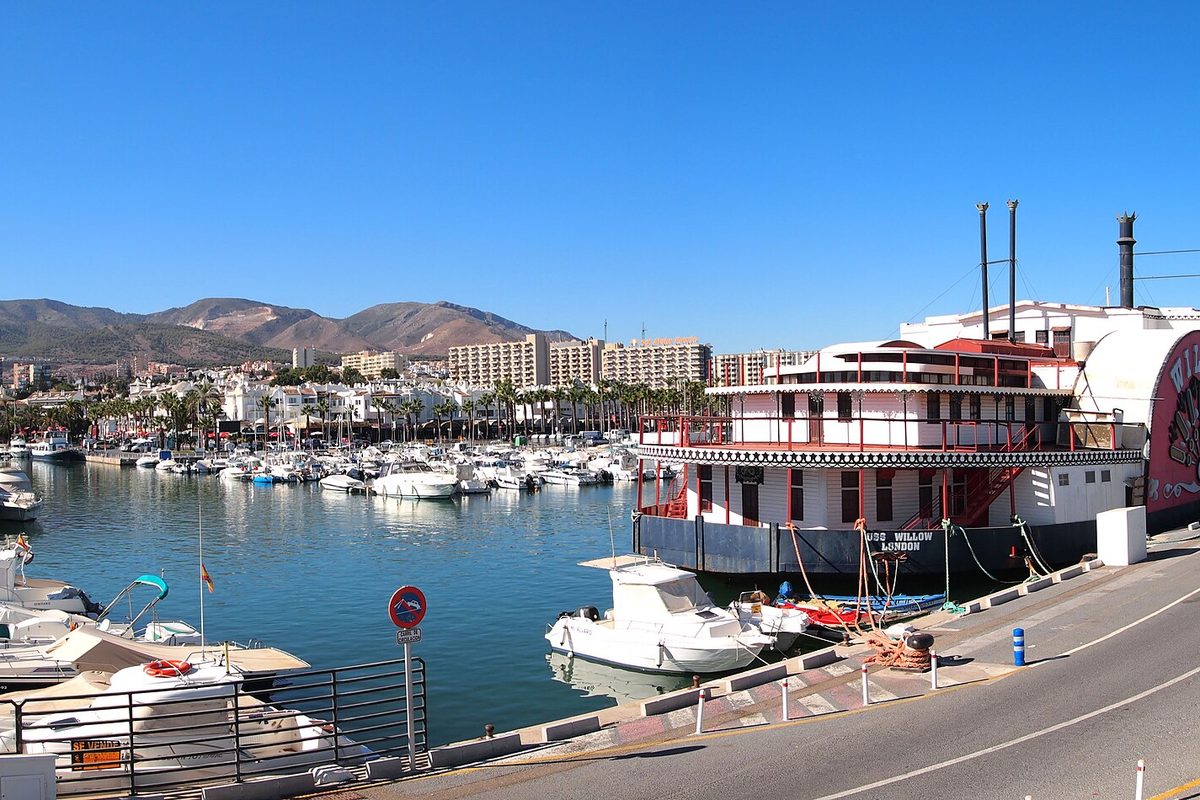 Boats in Puerto Marina, with the mountains behind
