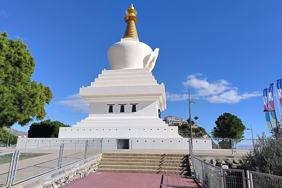 The Buddhist stupa, white with its golden top