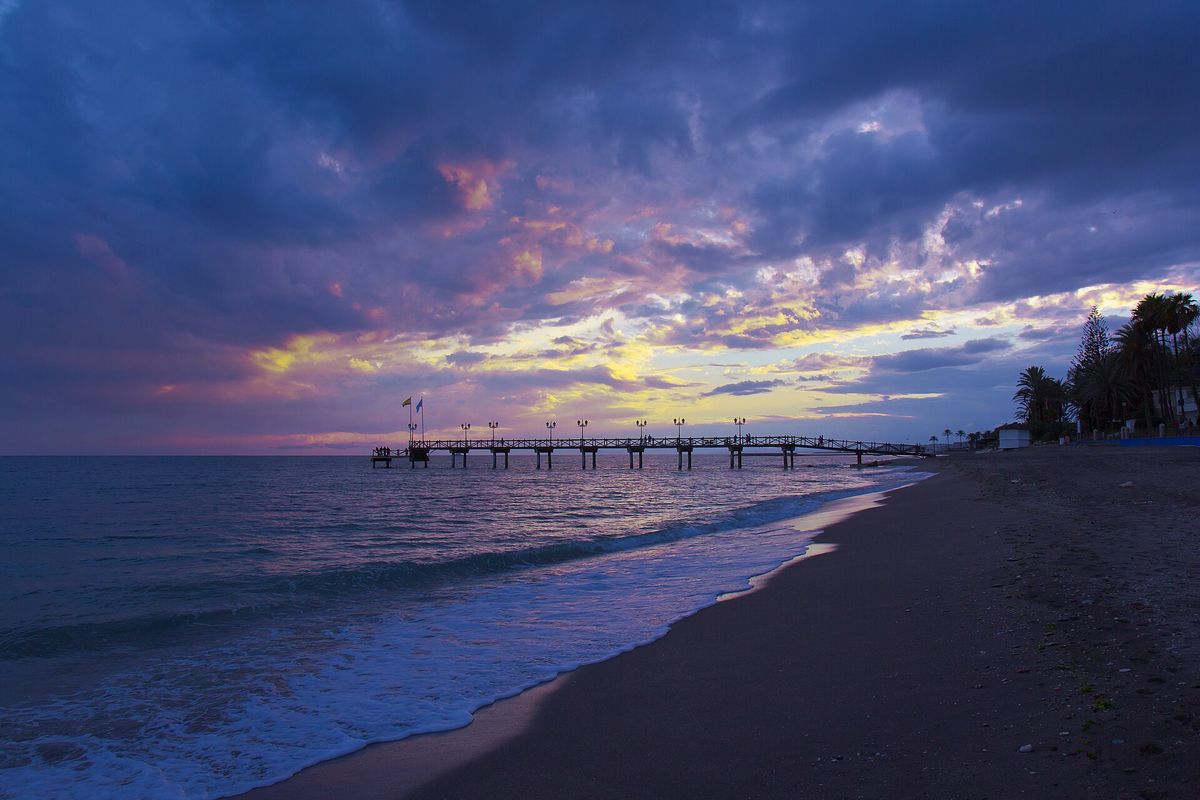 The pier and the beach at sunset