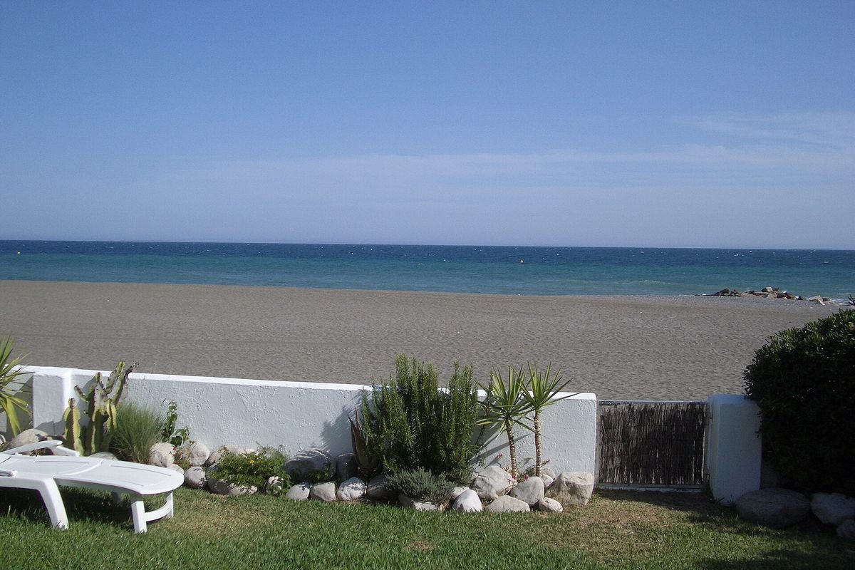 A garden gate onto the beach at Guadalmina