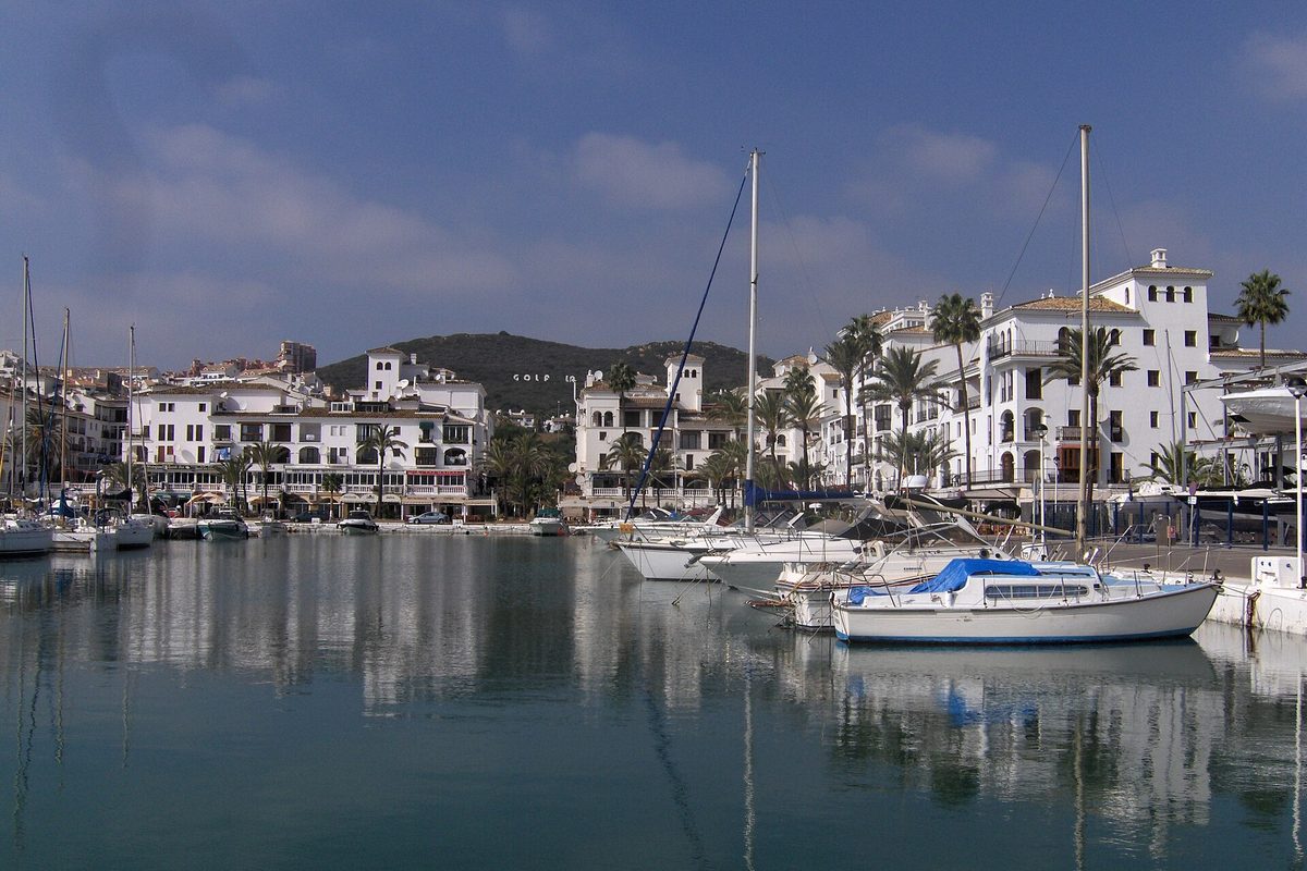 Boats and white apartment blocks around La Duquesa marina