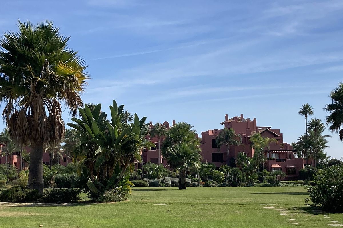 Gardens and terracotta apartments near Guadalmansa
