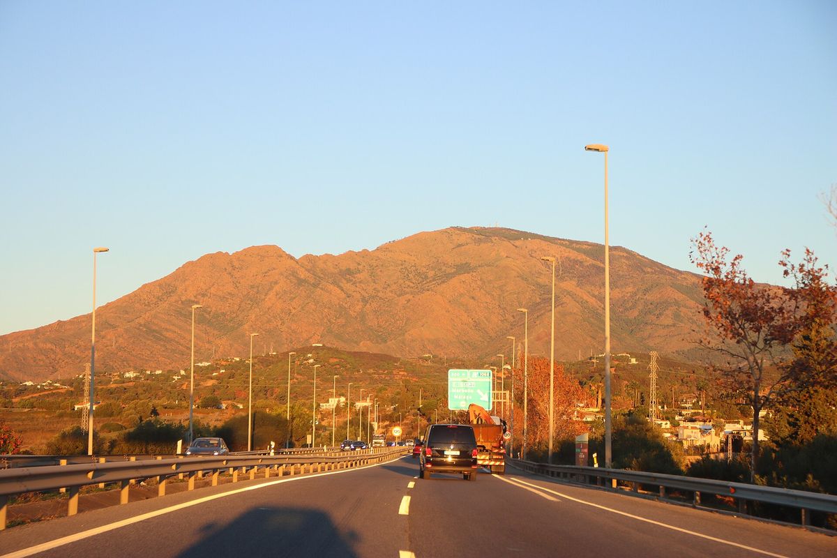 The A-7 at Estepona at sunset, with the mountains ahead