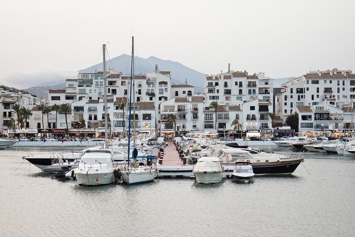 The marina and the white blocks around it, with La Concha behind
