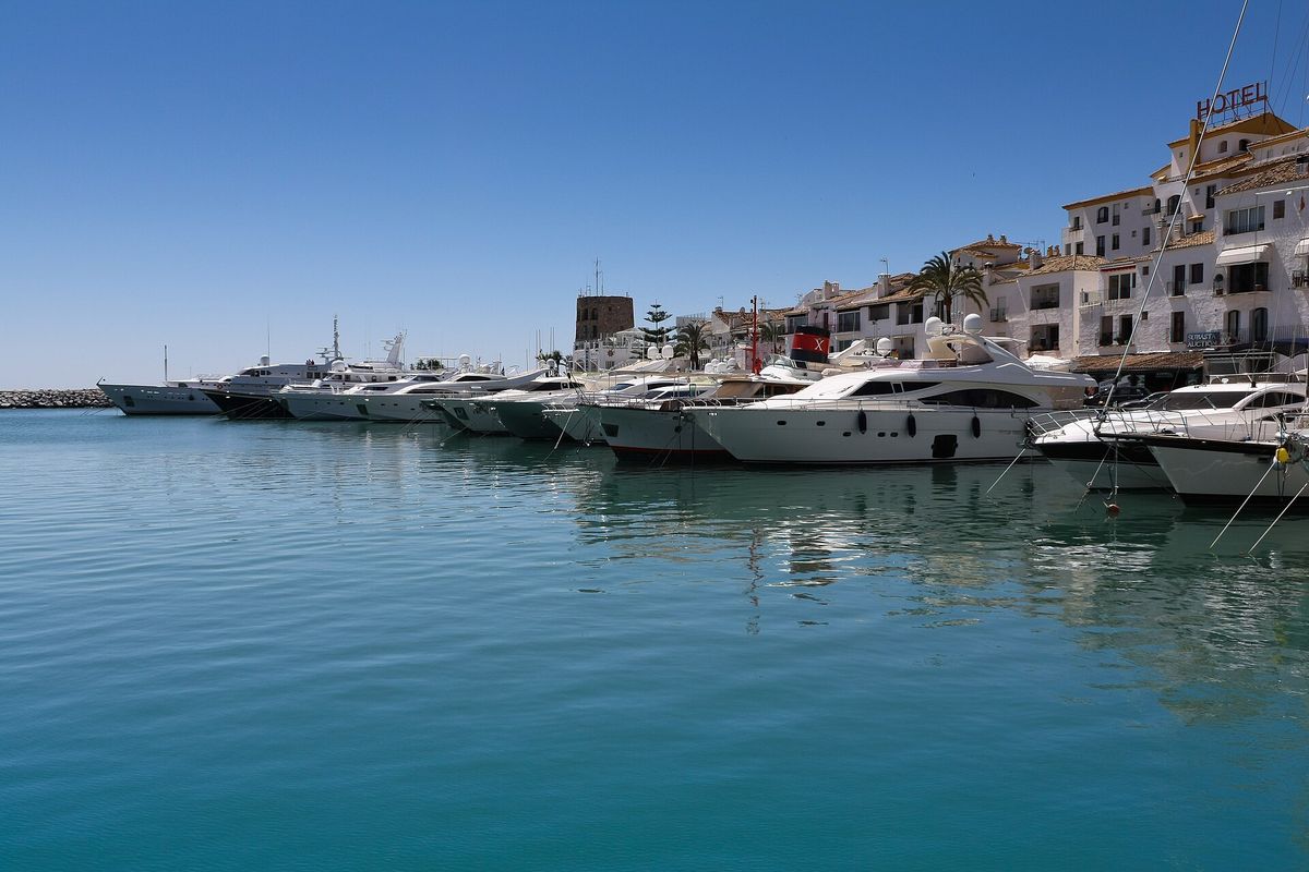 Yachts along the frontline of the port on a bright day