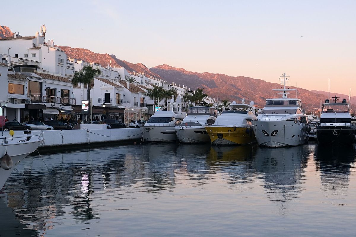 Frontline buildings and yachts at dusk