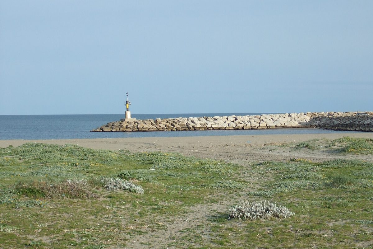 The beach and the breakwater lighthouse at Sotogrande