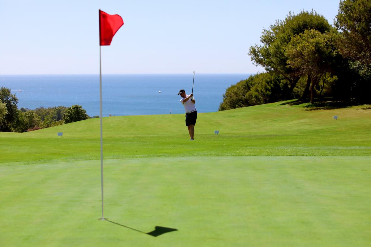 Approaching a green with the Mediterranean behind