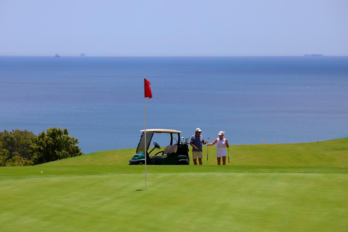 Buggy at the flag with the sea beyond