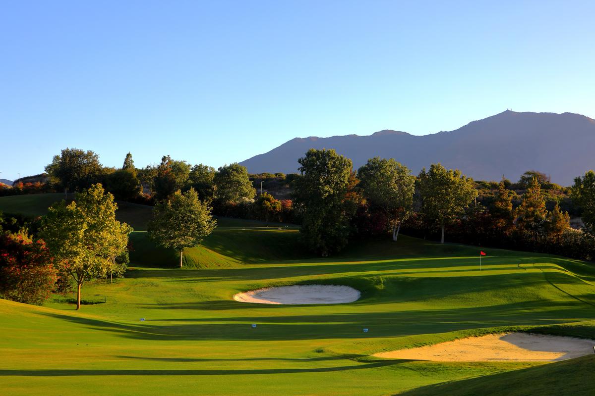 Bunkered green with the mountains behind