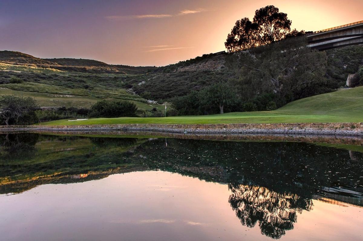 The lake on hole 3 at sunset